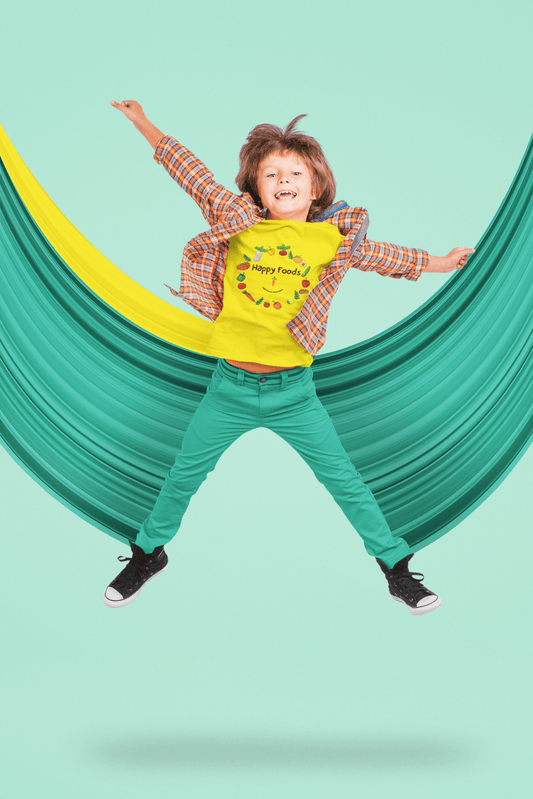 A boy happily jumps in a hammock, wearing a yellow logo shirt. Close-ups show a shoe detail. Kids heavy cotton tee, 100% cotton, durable twill tape shoulders, curl-resistant collar, no side seams.