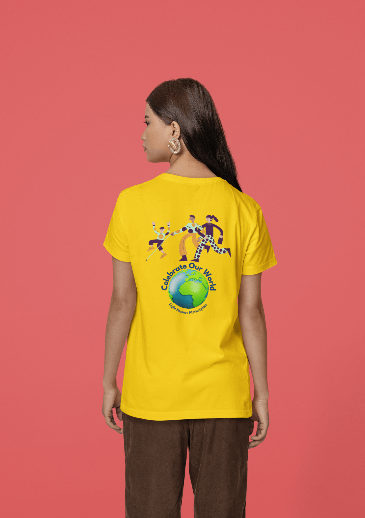 A person in a yellow unisex t-shirt with a globe and people graphic. Made of soft 100% cotton, twill tape shoulders, no side seams, and ribbed collar. Ethically sourced and Oeko-Tex certified.