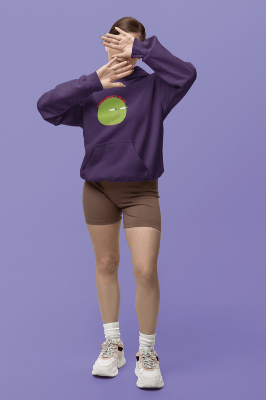 A person in a purple hooded sweatshirt and shorts, showcasing a close-up of sneakers. Unisex heavy blend hoodie, 50% cotton, 50% polyester, with kangaroo pocket and color-matched drawstring for style and comfort.