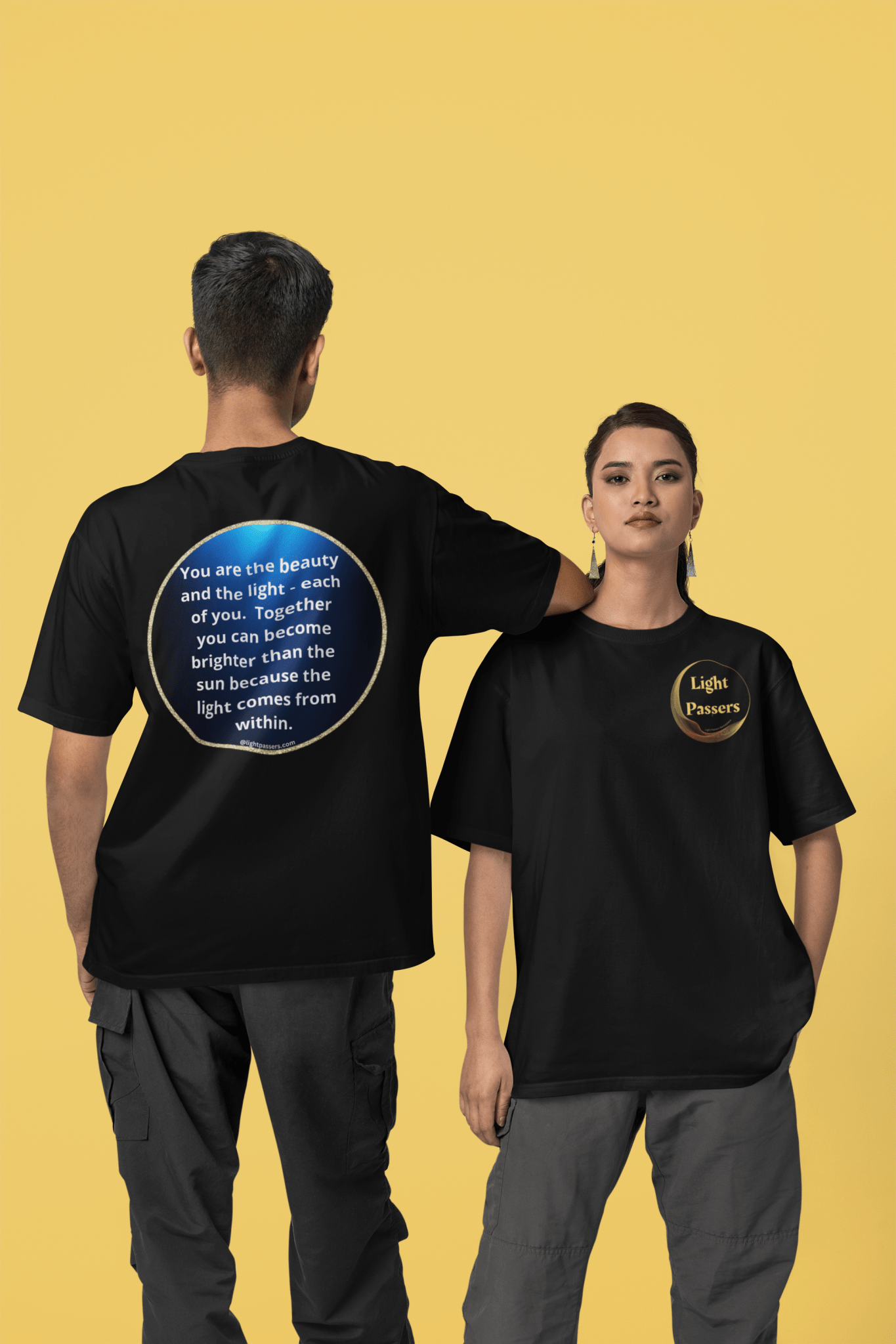 A man and woman in matching t-shirts, featuring a blue circle with white text, showcasing the Beauty Navy Circle Back LP Logo Unisex T-Shirt. Classic fit, 100% cotton, tear-away label, no side seams for comfort.