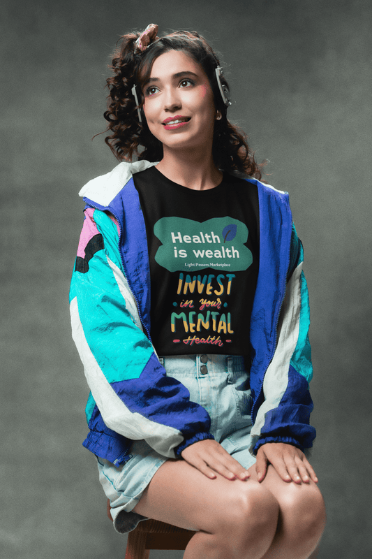 A woman in a colorful jacket and a person in a black shirt pose in an Invest in Mental Health Unisex T-shirt. Made of soft 100% cotton, featuring twill tape shoulders and a ribbed collar.