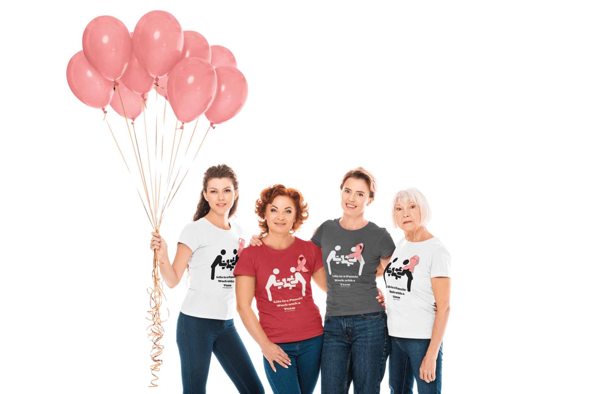 A group of people, including women, posing with balloons, one woman holding ribbons, wearing shirts with pink ribbons, showcasing the Life is a Puzzle Team Unisex T-shirt.