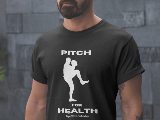 A man in a black shirt, showcasing the Pitch for Health Unisex T-Shirt. Made of soft 100% cotton, featuring twill tape shoulders for durability and a ribbed collar. Ethically crafted with US cotton.