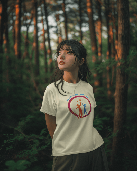 A woman in a white shirt stands in the woods, showcasing the Reach for Your Light Unisex T-Shirt. Made of soft 100% cotton, featuring twill tape shoulders and a ribbed collar for durability and comfort.