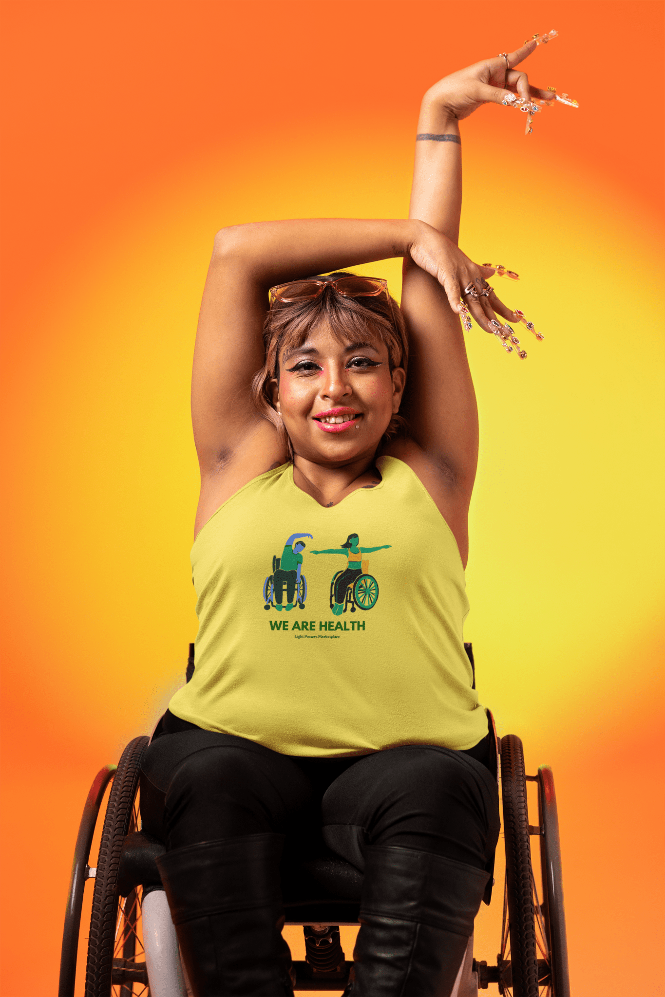 A woman in a wheelchair and a man in a wheelchair wearing a Wheelchair Yoga Unisex T-Shirt. Soft 100% cotton tee with twill tape shoulders, ribbed collar, and no side seams for ultimate comfort and durability.