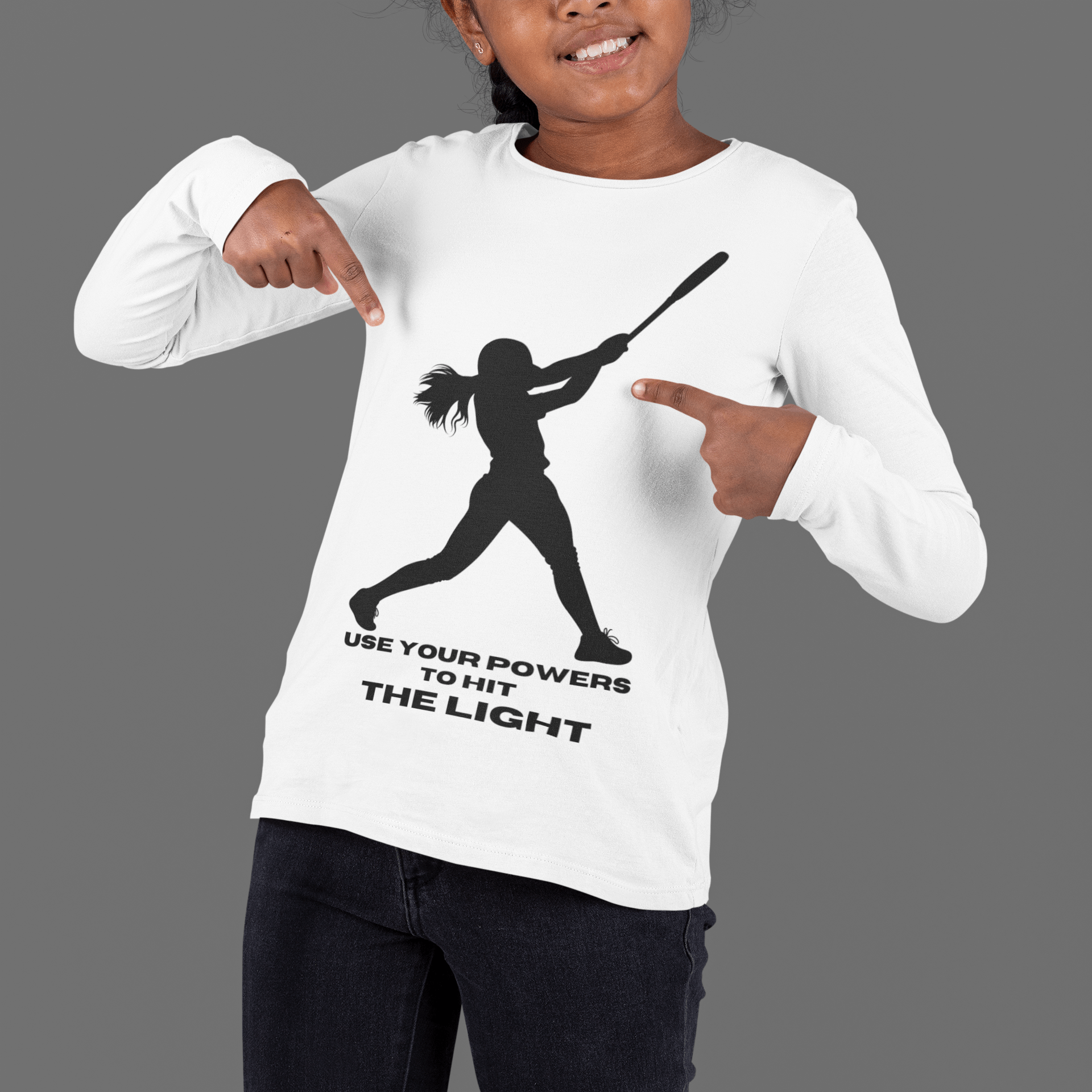 A girl points at her Sport-Tek PosiCharge ® Competitor™ tee, made of 100% moisture-wicking polyester. Lightweight, breathable, and perfect for active kids.