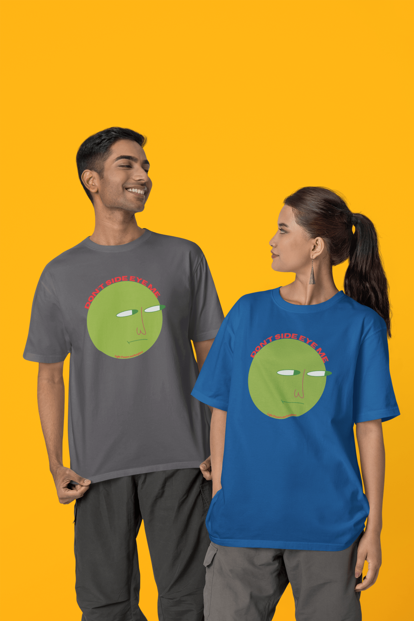 A man and woman in matching shirts, smiling. Unisex soft-style t-shirt in 100% cotton, no side seams, ribbed collar. Lightweight, versatile fit for all occasions. Made ethically with US cotton.