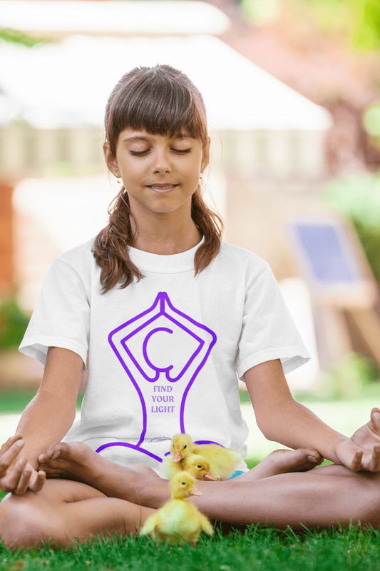 A girl meditating in grass surrounded by ducks, holding a baby duck. Youth tee in 100% cotton, durable twill tape shoulders, ribbed collar, no side seams. Ethically made, soft touch, tear-away label.