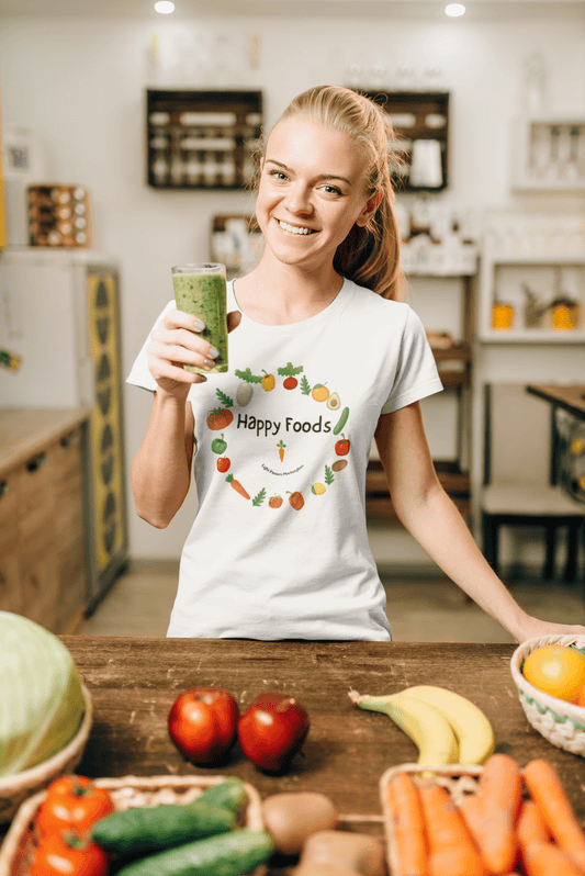 A woman in casual comfort holds a green drink, embodying the Happy Foods Ring Unisex T-Shirt's versatile style. Made from soft 100% cotton, this tee ensures durability and year-round bliss.